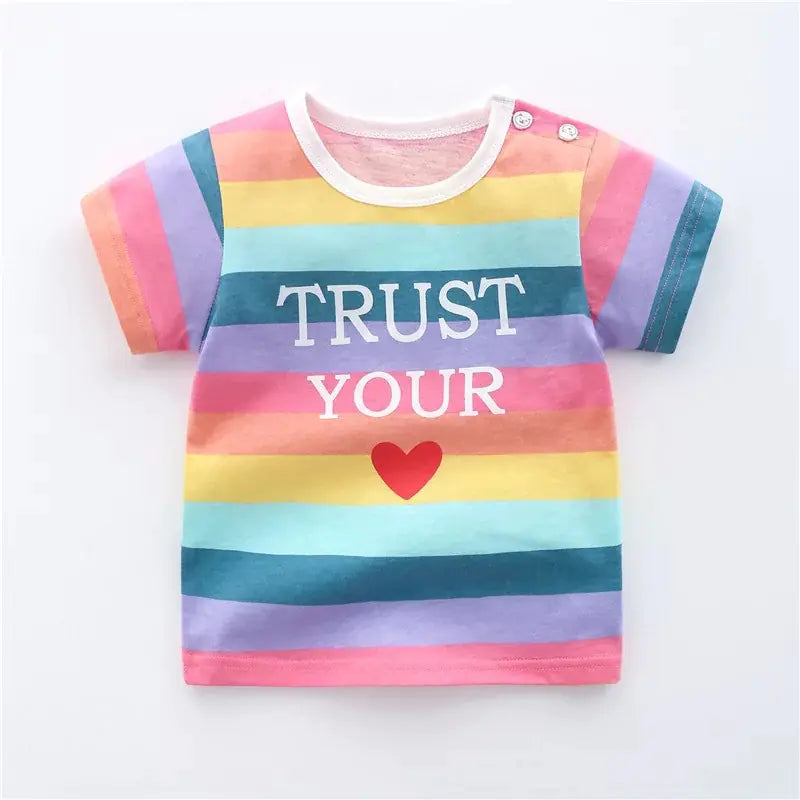 Colorful striped shirt with 'Trust Your Heart' text on a white background
