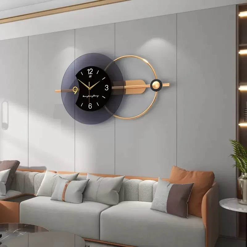 Modern wall clock with gold accents on a gray wall above a sofa.