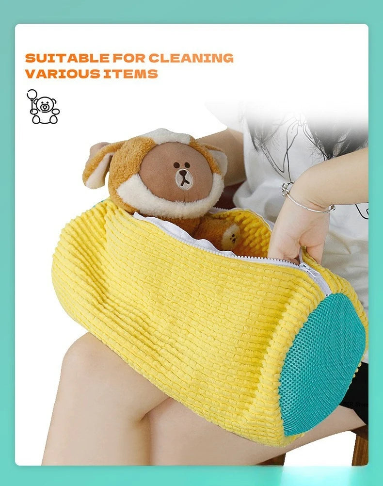 Yellow cleaning brush with teal end held by a person, suitable for cleaning various items.