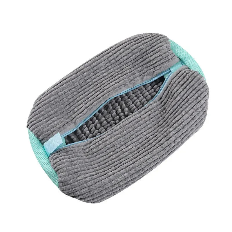 Gray and teal cleaning brush on a white background
