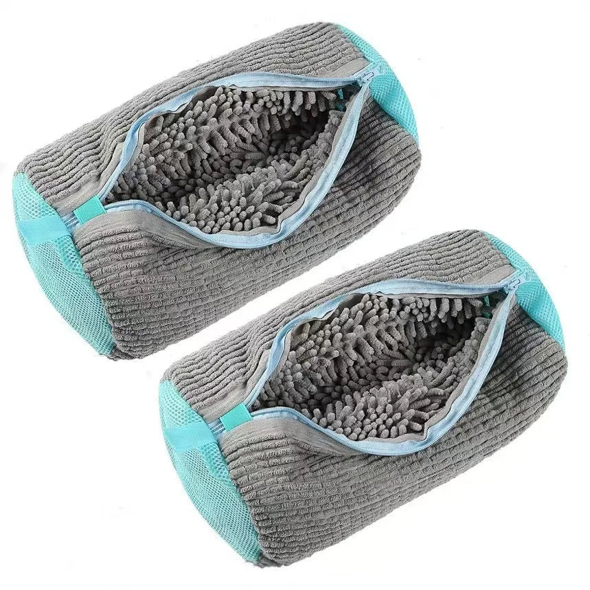 Two gray microfiber cleaning pads with teal edges on a white background