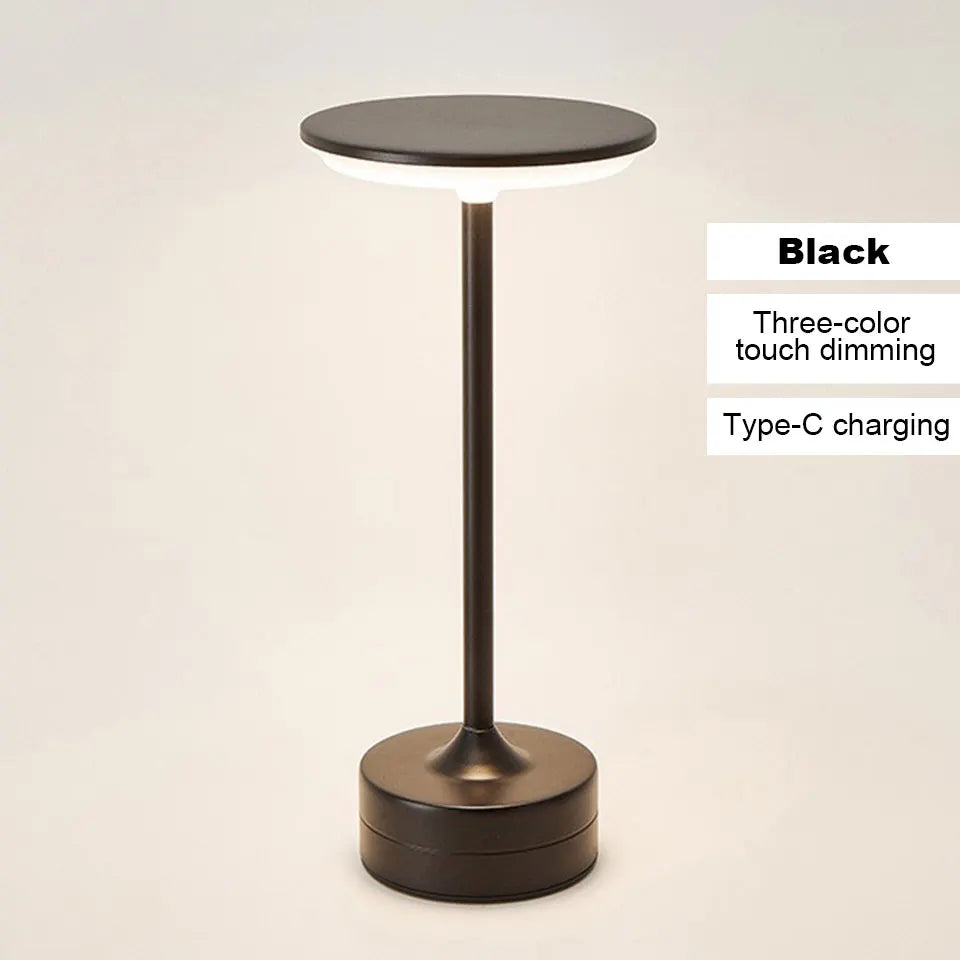 Black table lamp with three-color touch dimming and Type-C charging on a beige background