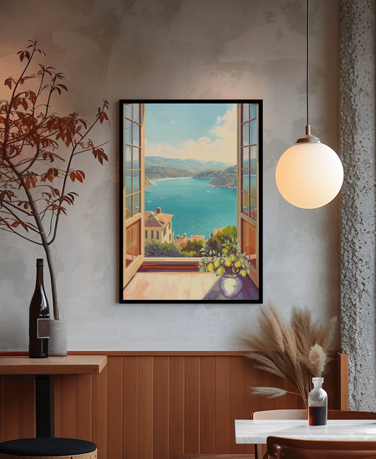 Framed artwork of a coastal scene on a wall in a room with decor elements.