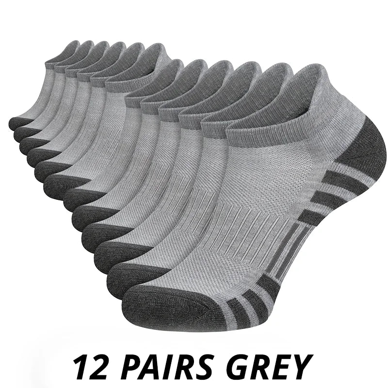 12 pairs of grey socks with black accents on a white background