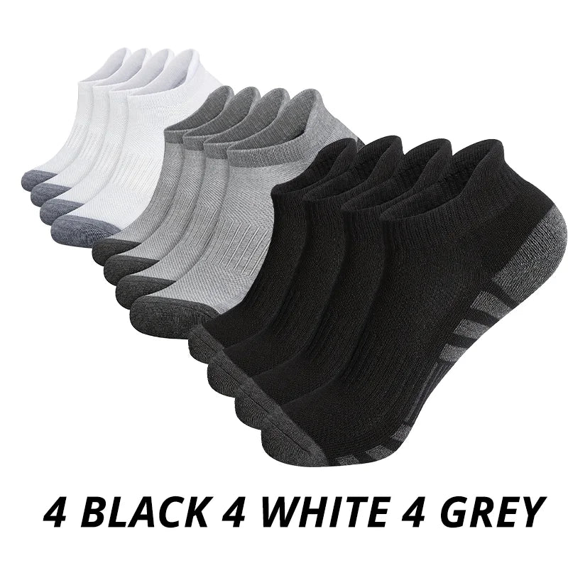 Set of black, white, and gray socks on a white background