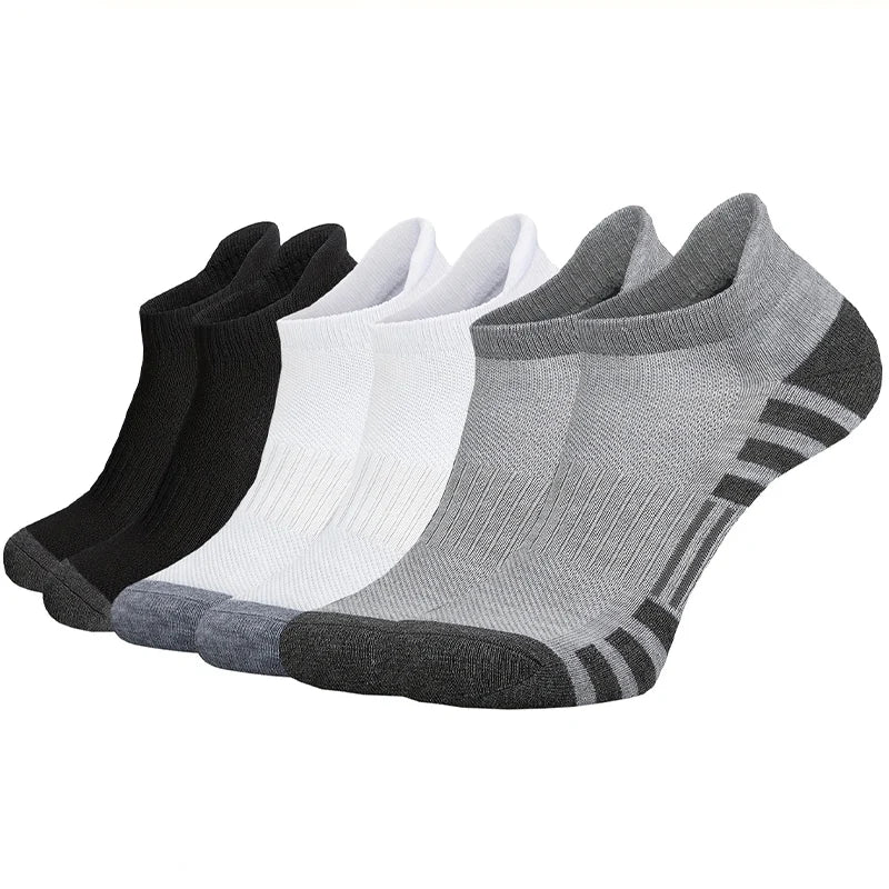 Set of black, white, and gray socks on a white background