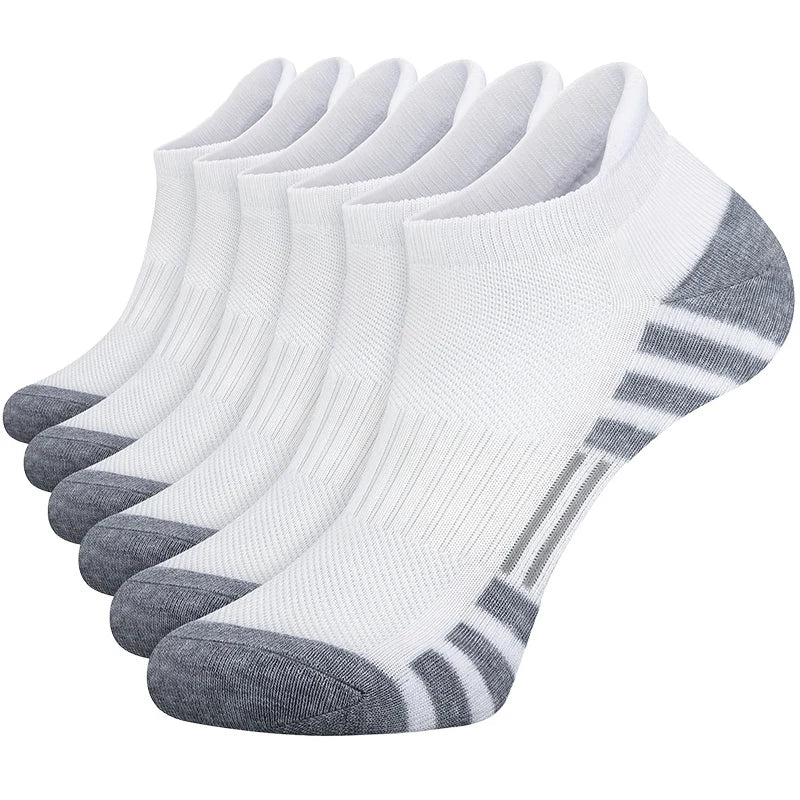 Set of six white ankle socks with gray accents on a white background