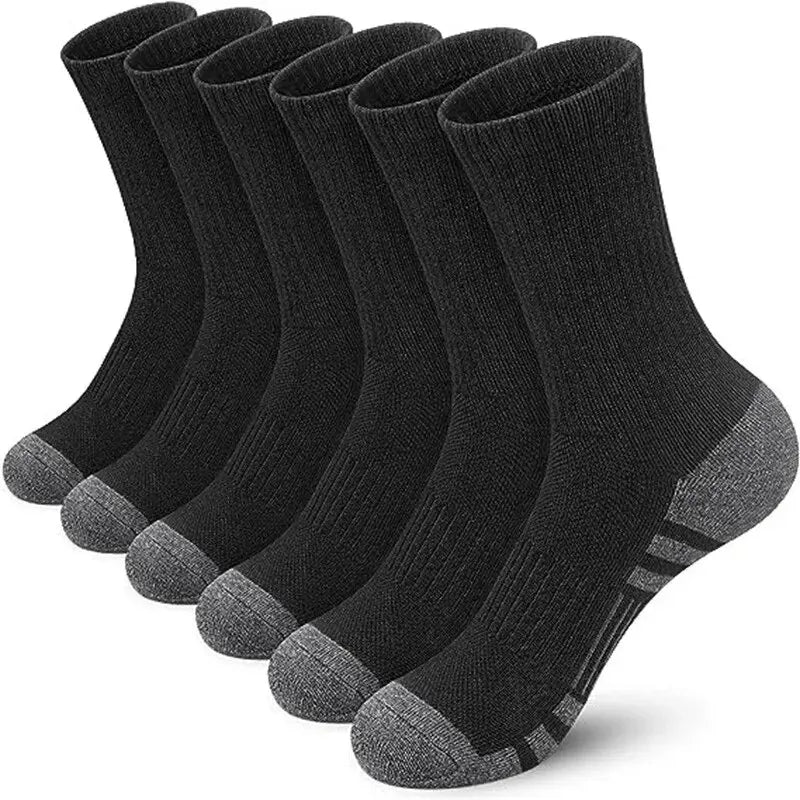 Set of six black socks with gray toes and heels on a white background