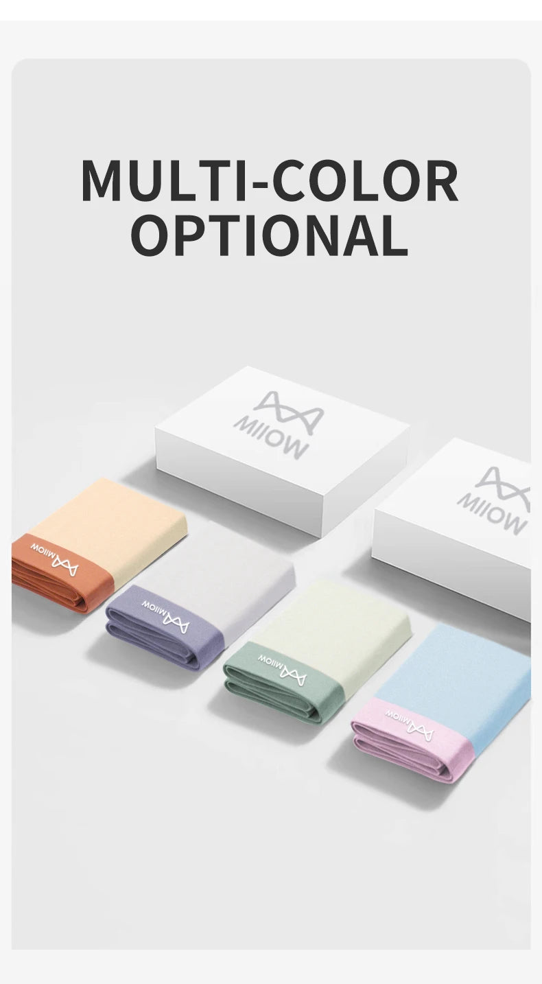 Set of colorful folded fabrics with 'MIOW' branding on a light gray background.