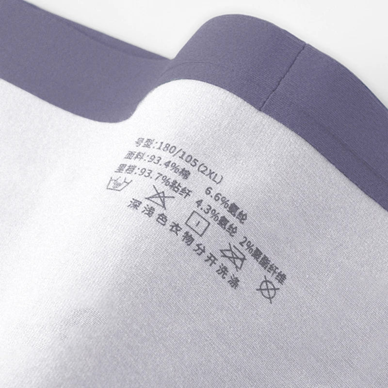Close-up of a fabric label on a garment with text and symbols.