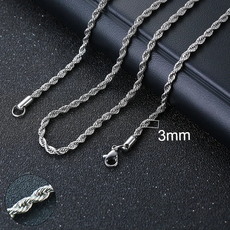 Silver rope chain necklace on a dark surface with a close-up of a chain link showing the thickness.