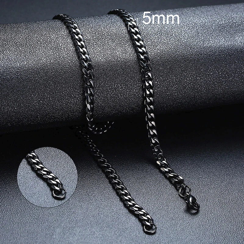 Black chain bracelet on a gray surface with '5mm' text