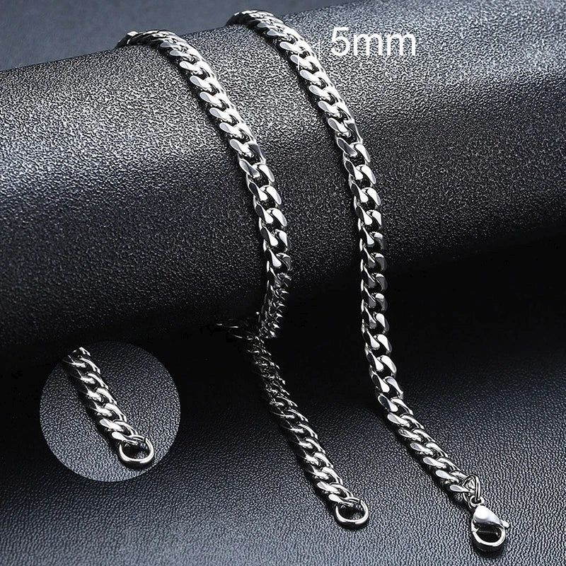 Silver chain bracelet on a dark surface with '5mm' text.