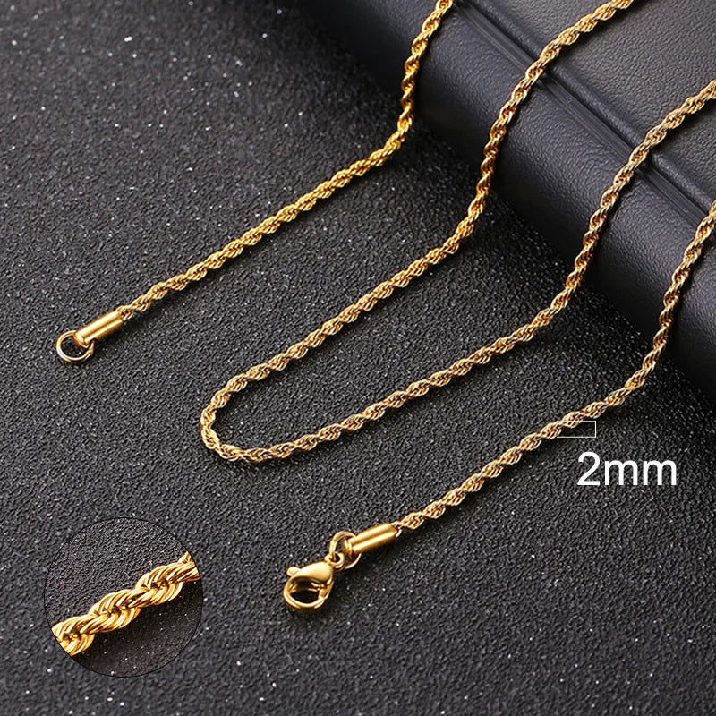 Gold chain necklace with clasp on a dark surface