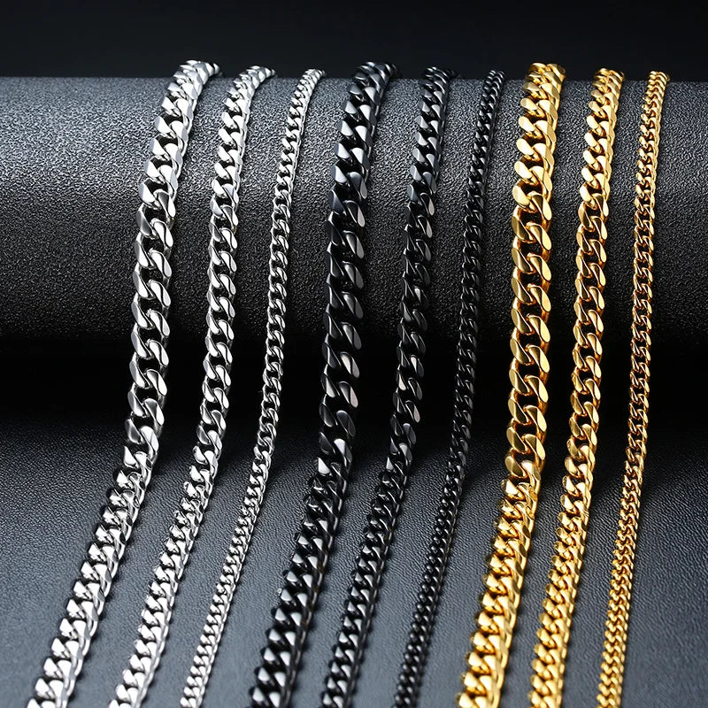 Men’s Gold, black and silver Stainless Steel Cuban Chain Necklace on display table