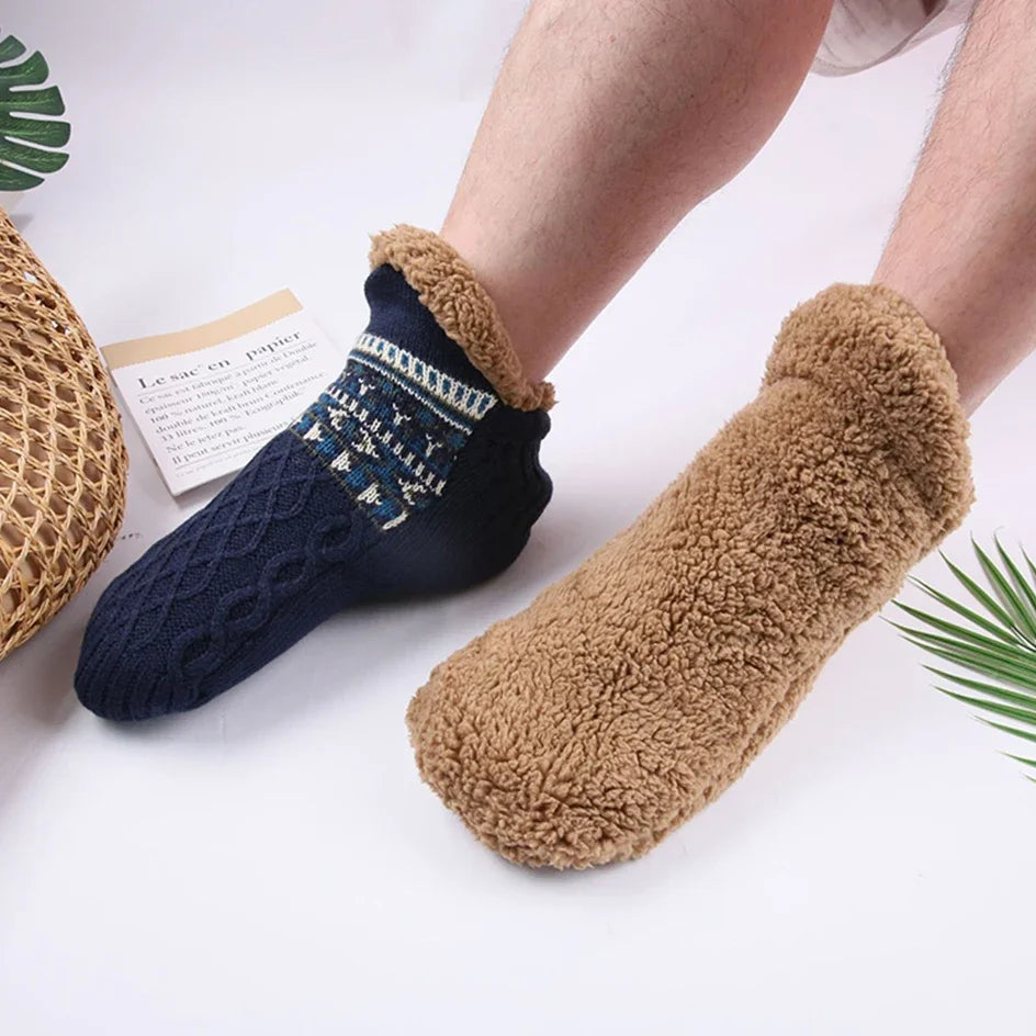 Pair of navy blue and brown fuzzy socks on a white background
