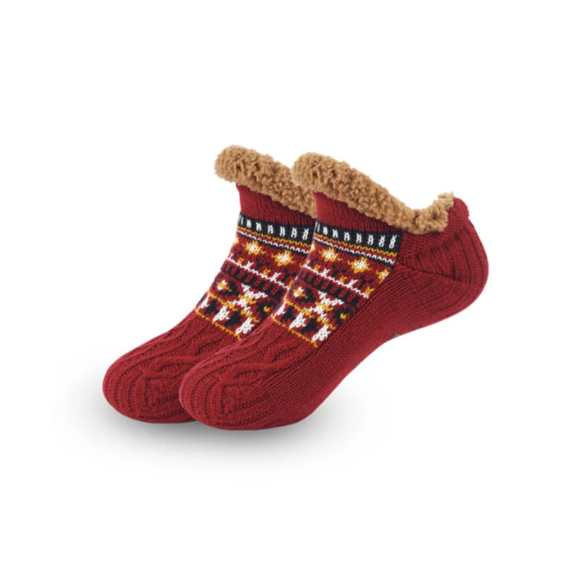 Red socks with a patterned cuff on a white background