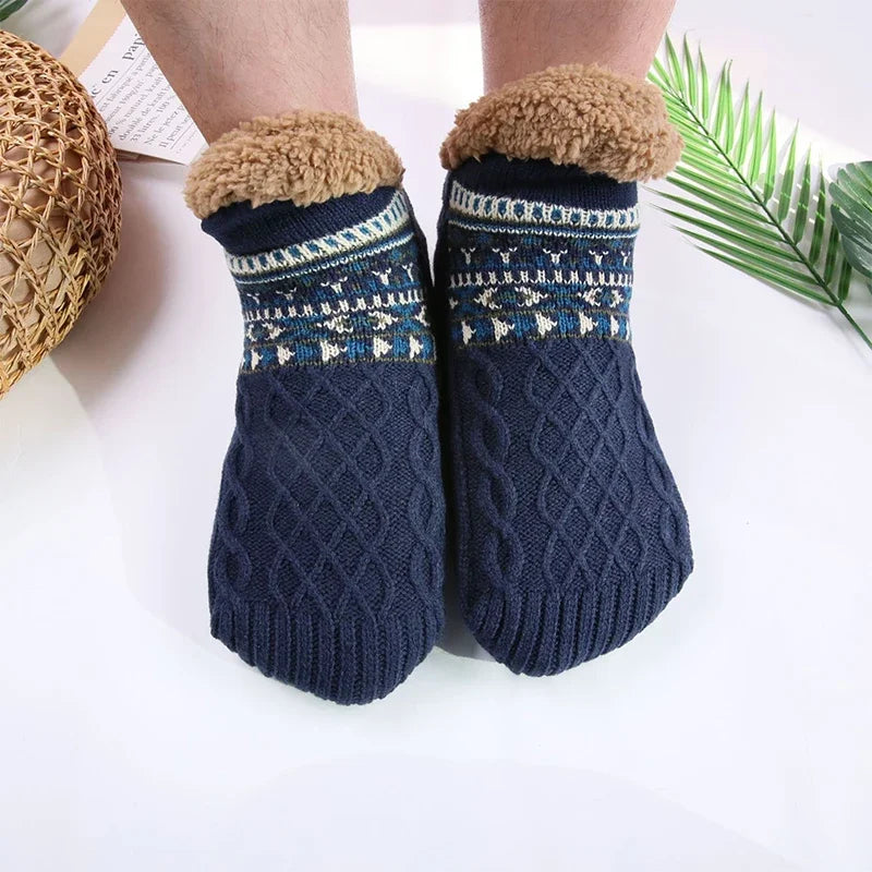 Navy blue socks with patterned cuffs and fleece lining on a white background