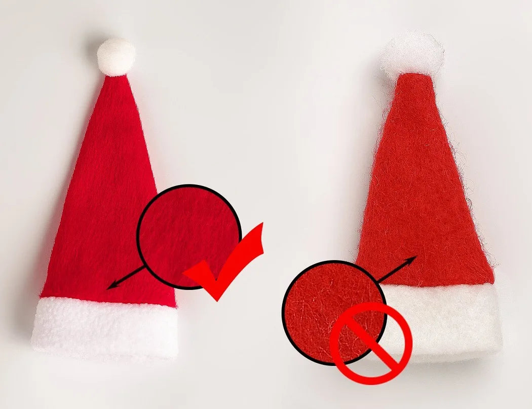 Two red Santa hats with white trim on a light gray background, one hat is shown with a textured surface and the other with a smoother surface.