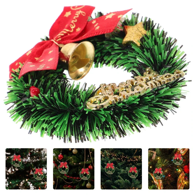 Decorative Christmas wreath with green tinsel, gold bell, red bow, and gold star on a white background.