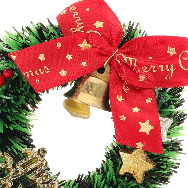 Christmas wreath with gold bells and a red ribbon with 'Merry Christmas' text.