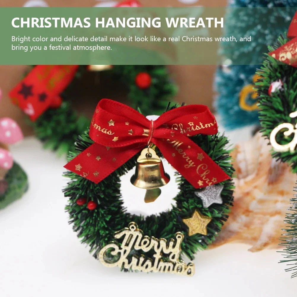 Christmas hanging wreath with red bow and gold bell on a white background