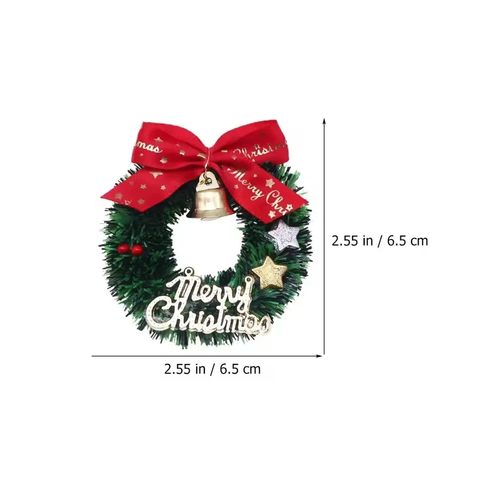 Christmas wreath with a red bow, gold bell, and 'Merry Christmas' decorations with measurements on a white background.