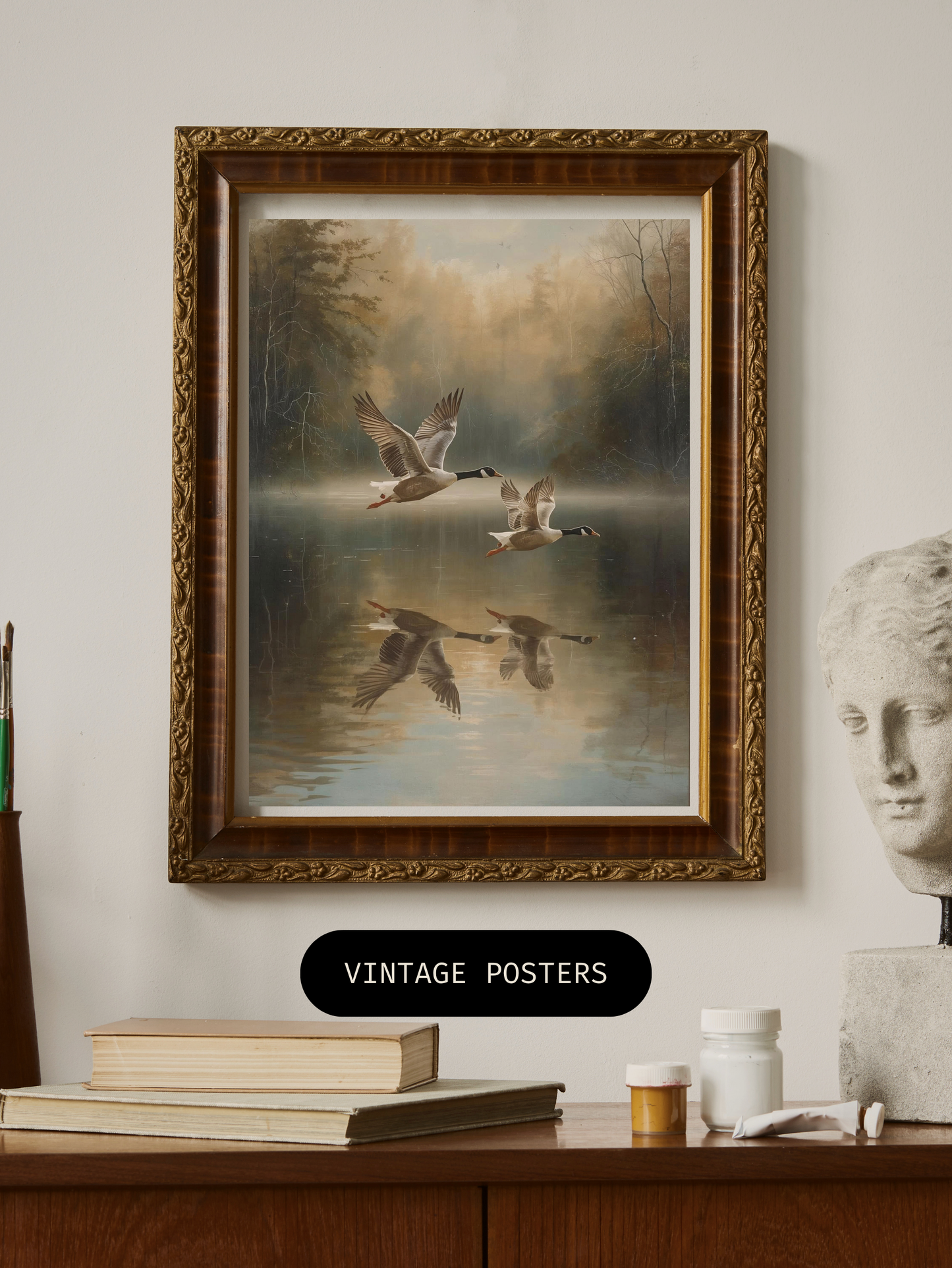 framed geese lake poster with vintage style frame on wooden shelf