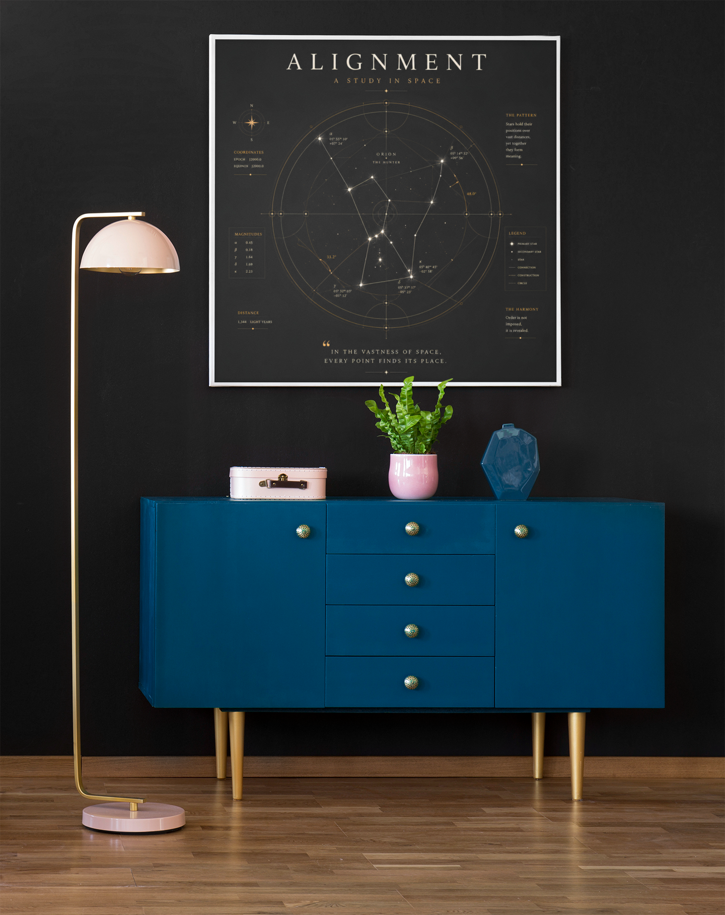 Geometric constellation wall art displayed above a blue sideboard in a modern interior with warm lighting.