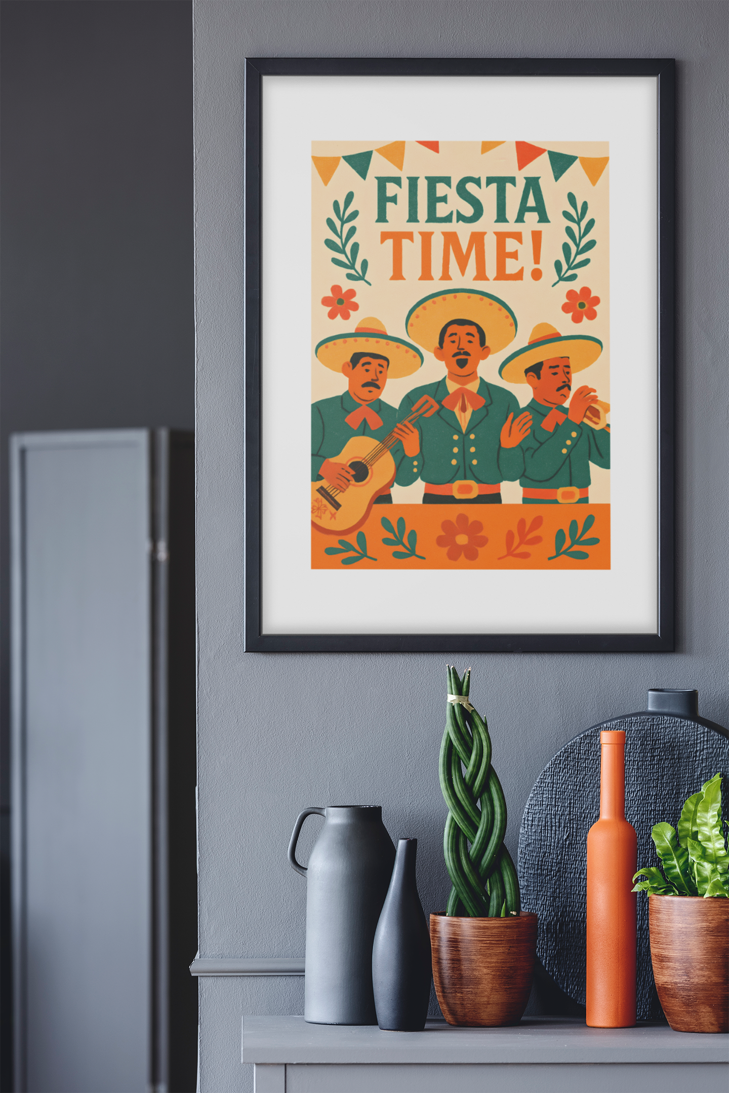 Framed poster with 'Fiesta Time!' text and mariachi illustration on a gray wall.