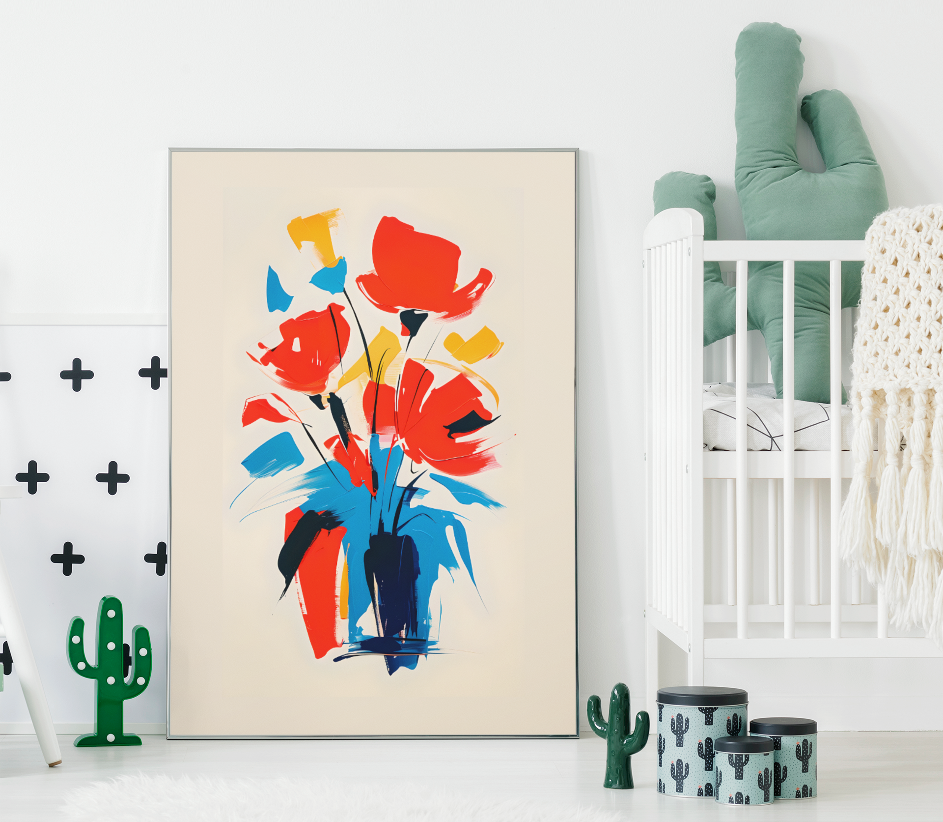 Abstract floral poster with bold red, yellow, and blue bouquet – colorful modern wall art displayed in bright nursery with crib and cactus décor.