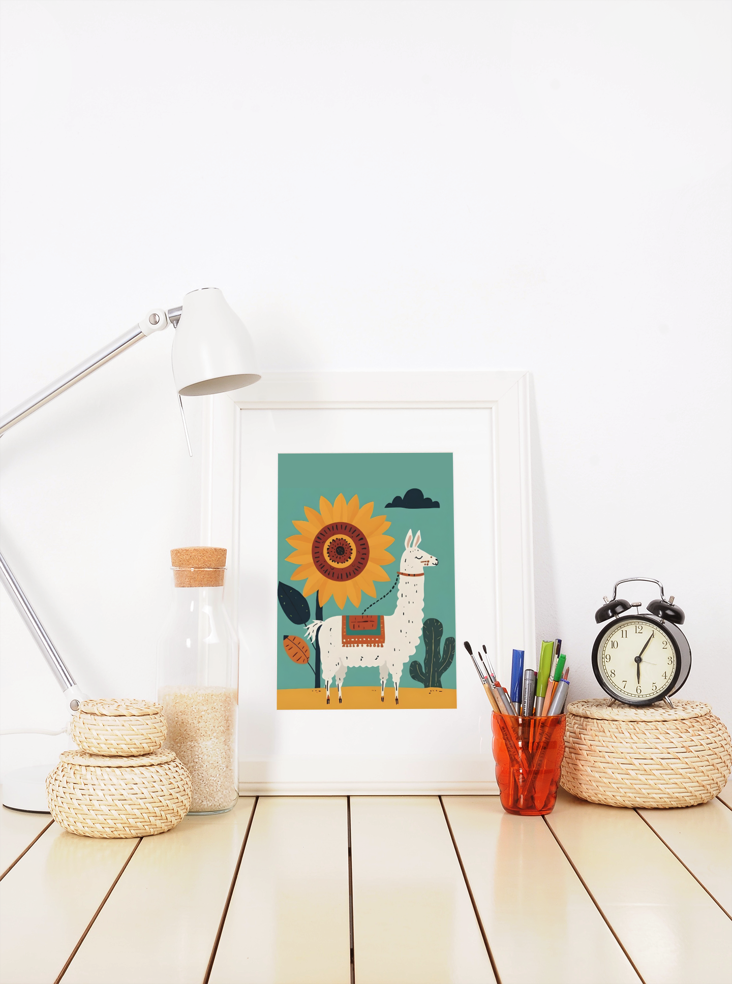 Framed artwork of a llama with a sun on a white wall above a desk.