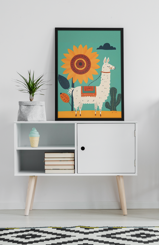 Framed illustration of a llama with a sun on a white shelf against a light gray wall.
