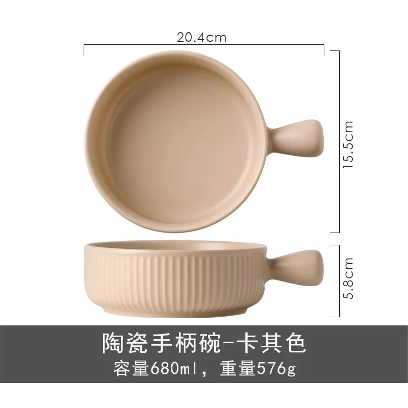 Beige ceramic bowl with handle and measurements on a white background