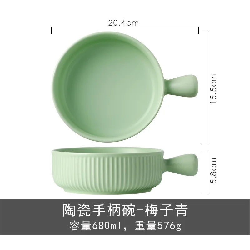 Green ceramic bowl with handle and measurements on a white background