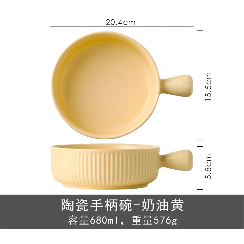 Yellow ceramic bowl with handle and measurements on a white background