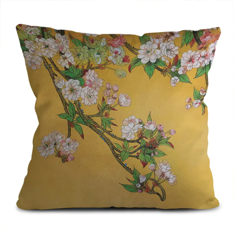 Decorative pillow with floral design on a yellow background