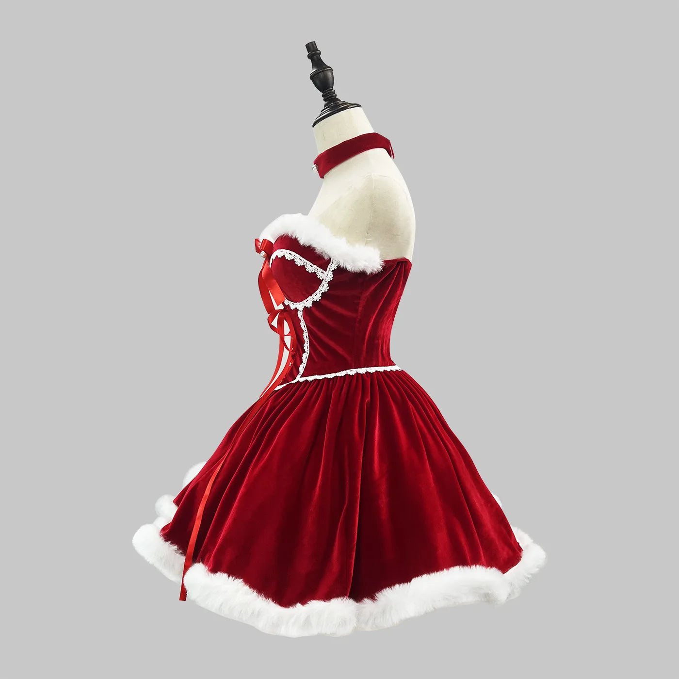 Red dress with white trim on a mannequin against a gray background