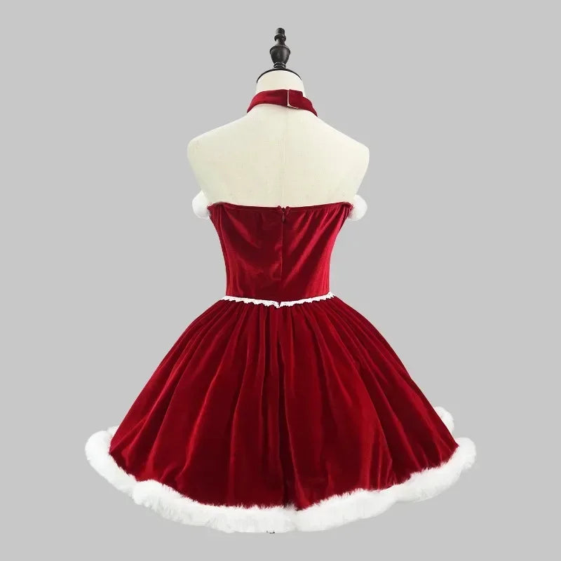 Red velvet dress with white trim on a mannequin against a gray background