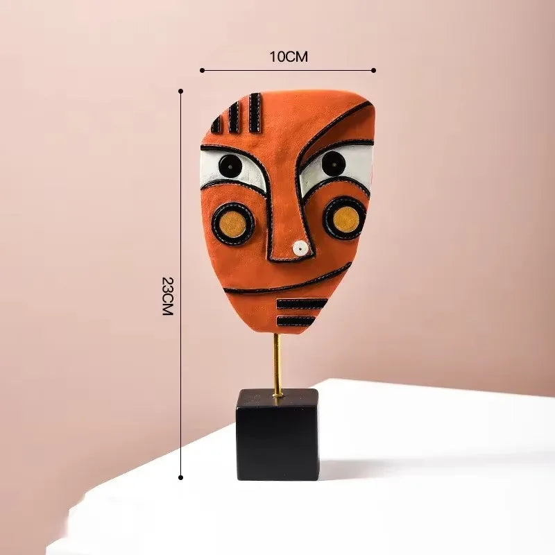 Decorative mask on a stand with measurements against a pink background