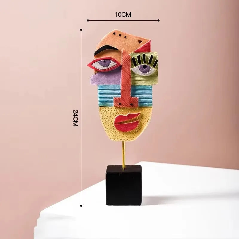 Colorful abstract face sculpture with measurements on a pink background