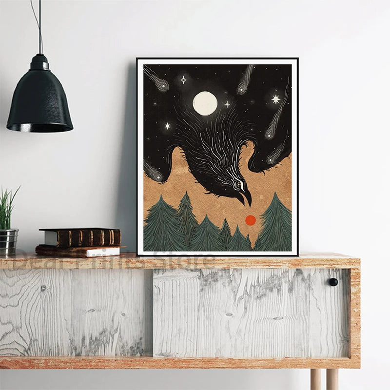 Framed artwork of a crow with a moon and stars on a wall above a wooden shelf.