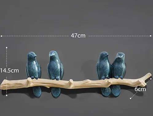 Decorative birds on a branch with measurements on a dark background