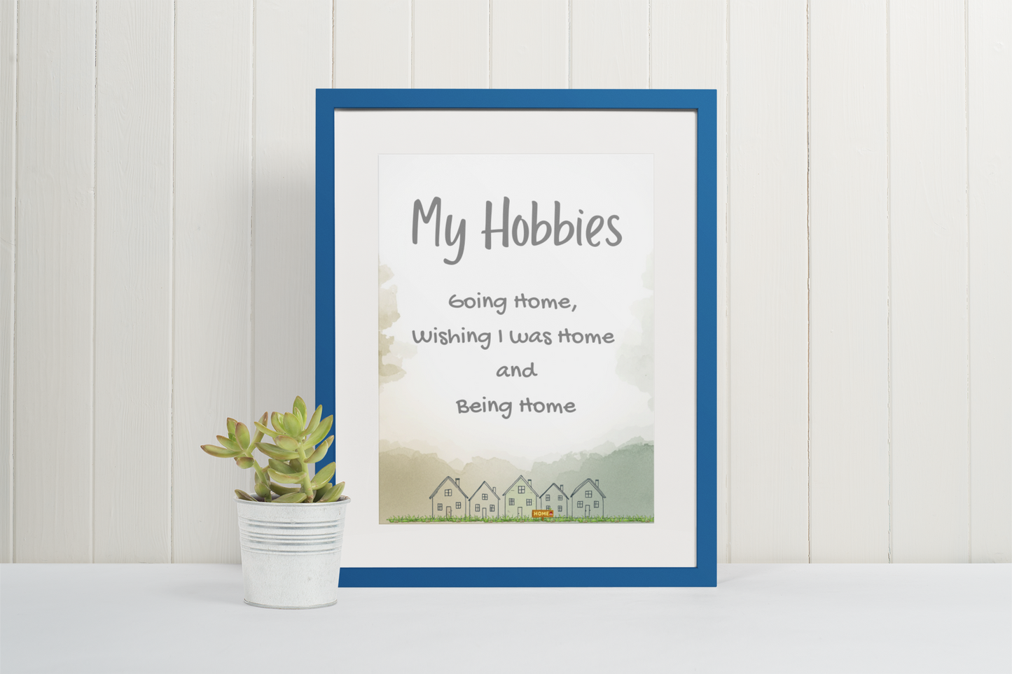 Cozy typography printable wall art featuring “My hobbies include going home, wishing I was home, and being home” with hand-drawn house illustrations