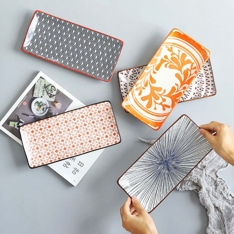 Collection of Nordic Japanese underglaze ceramic small fish plates, showcasing unique patterns and colors.
