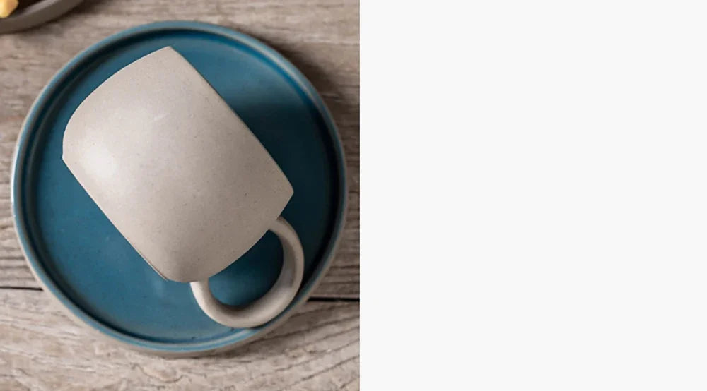 Ceramic mug on a blue plate with a blurred background
