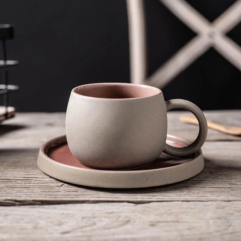 Ceramic cup and saucer set on a wooden surface with a dark background