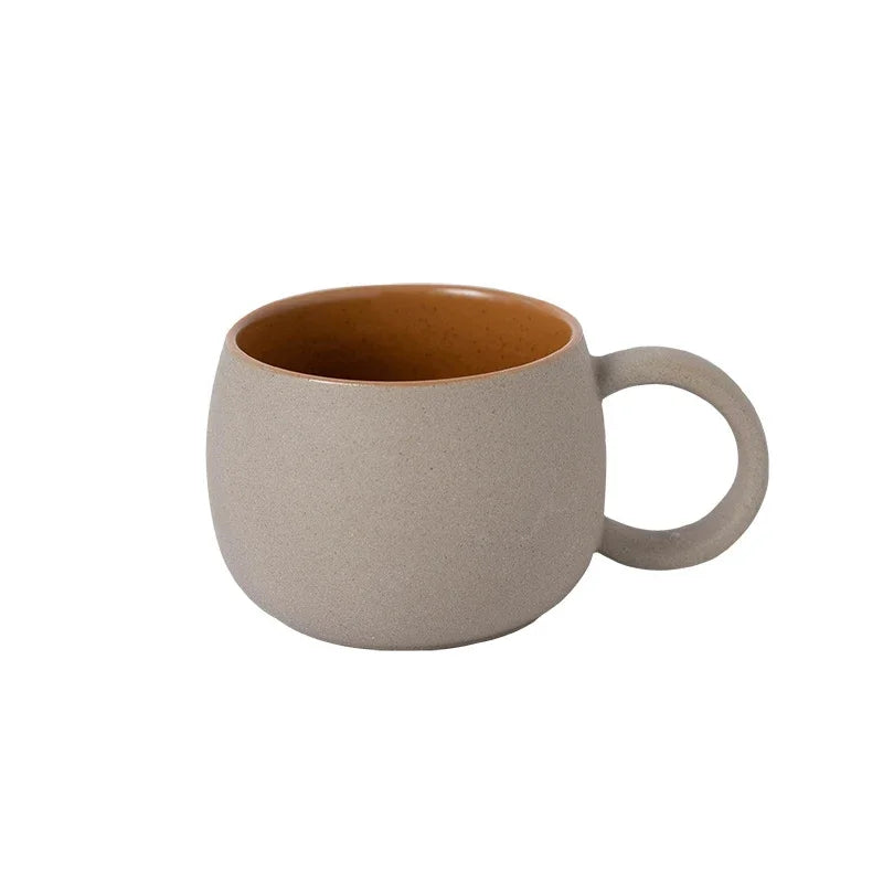 Beige ceramic mug on a white background