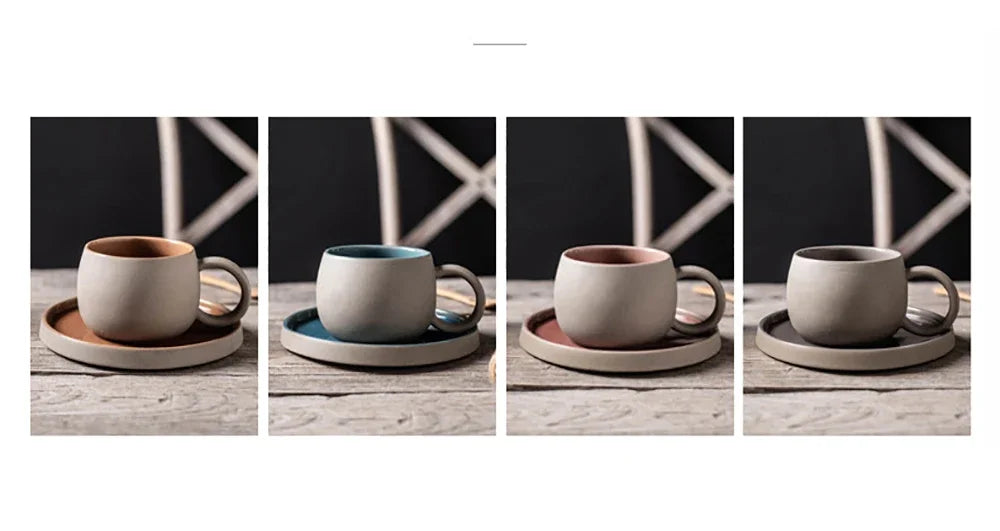 Four ceramic cups with saucers on a wooden surface against a dark background