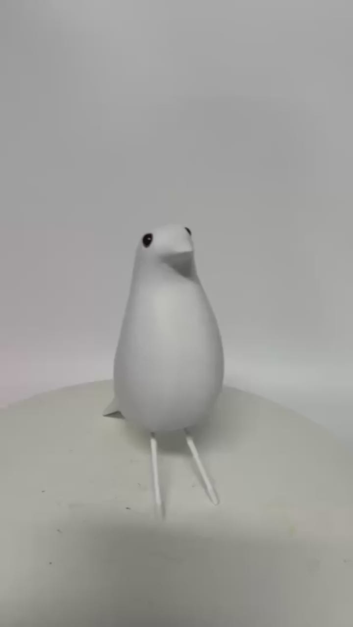 Video of a Matte resin bird sculpture in Nordic minimalist style displayed as a modern decorative ornament for living rooms, bedrooms and offices.